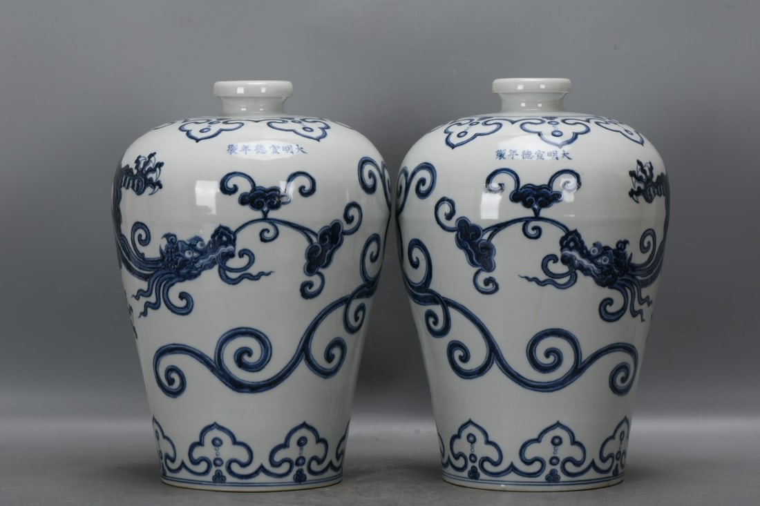 A pair of blue and white dragon-patterned plum vases from the Xuande period of the Ming Dynasty. (1 of 9)