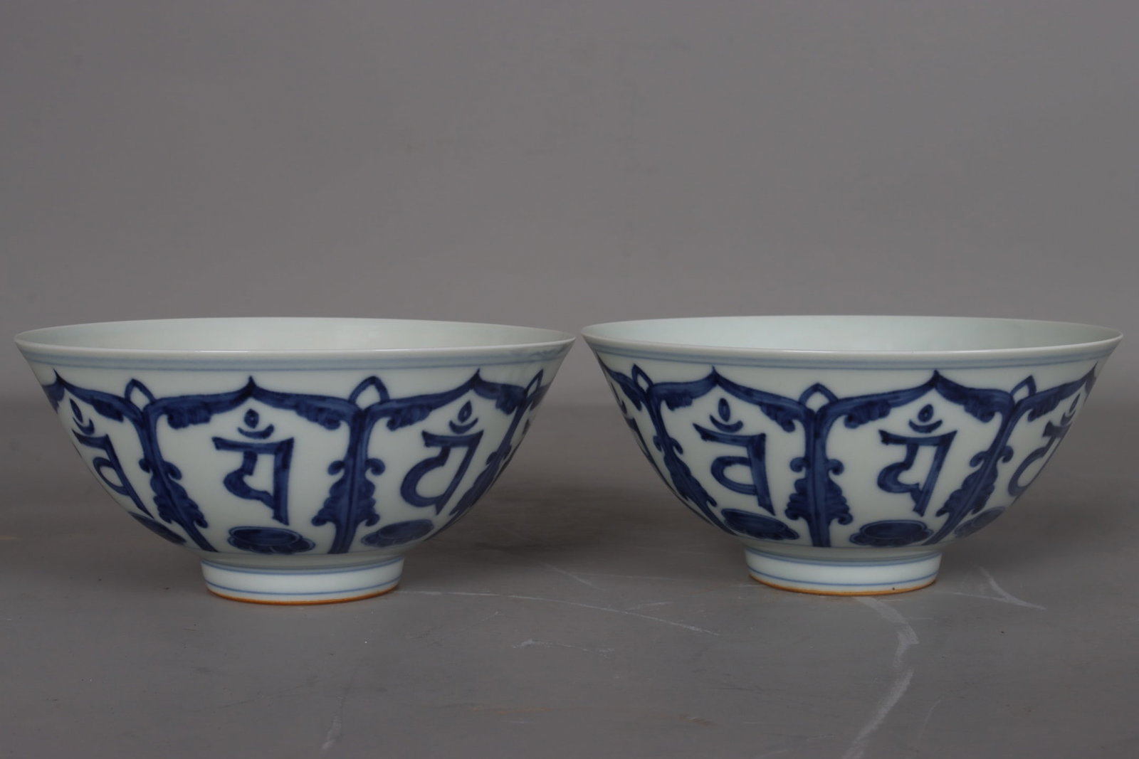 A pair of Ming and Chenghua blue and white porcelain bowls with Sanskrit inscriptions (1 of 9)