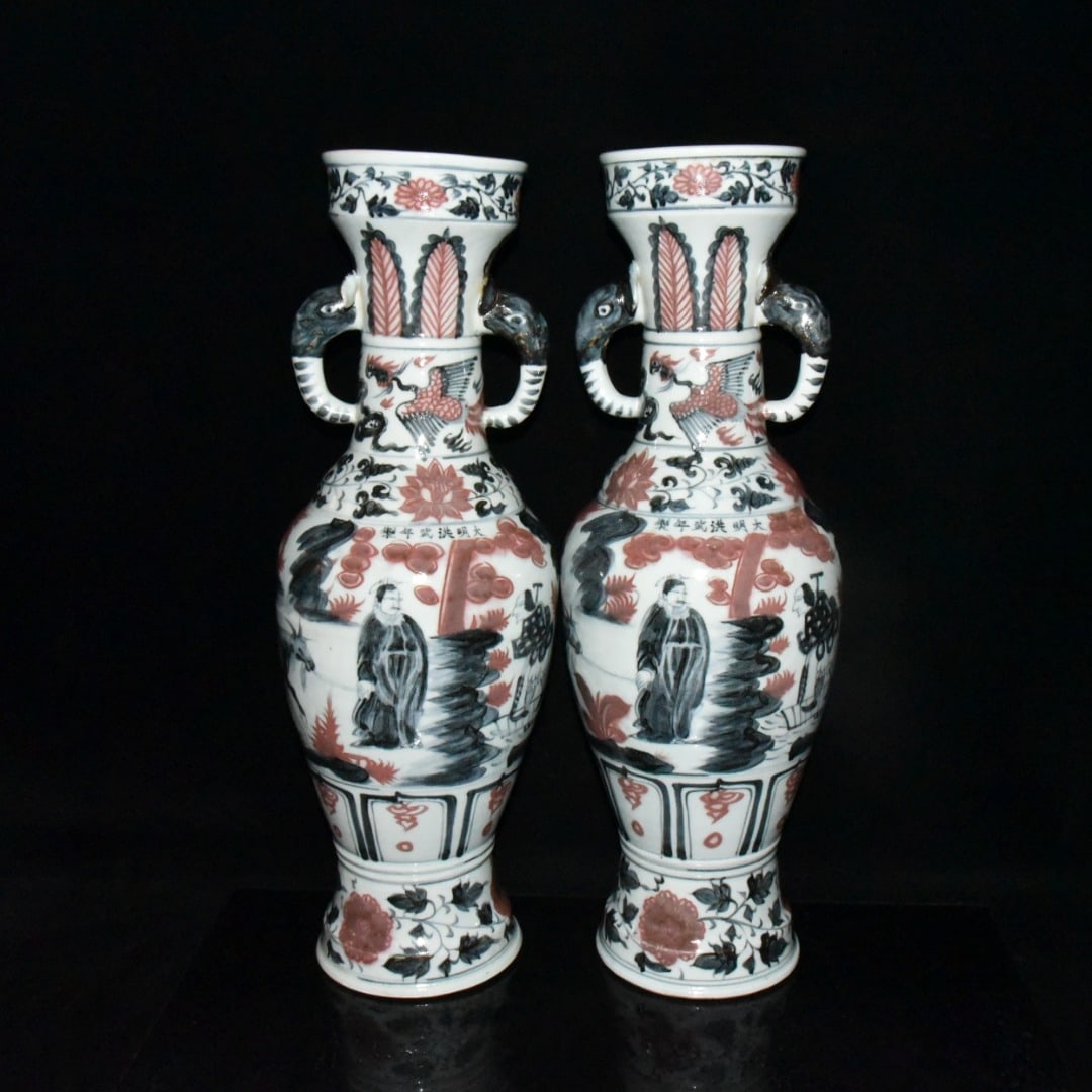 A pair of Ming Dynasty Hongwu blue and white underglaze red elephant-ear vases depicting Xiao He: A pair of Ming Dynasty Hongwu blue-and-white underglaze red vases depicting Xiao He chasing Han Xin, each with elephant-ear handles, 57.5 x 20 cm. Provenance:Private collection from a professor in ESC