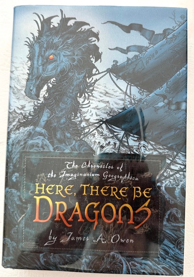 James A. Owen. Here There Be Dragons.: New York: 2006. With illustrations by the author; first printing. Inscribed on the title page "For Ruth" signed and dated 2006. On the front fly leaf is a 3/4 page original drawing titled "The Green