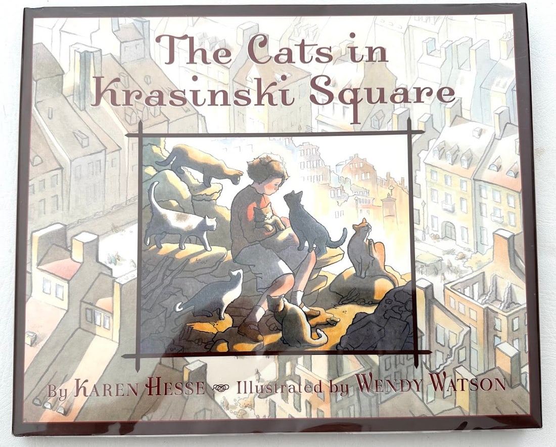 Karen Hesse. The Cats in Krasinsky Square.: New York: 2004. First printing. Illustrations by Wendy Watson. SIGNED by Watson on the title page with a small original drawing. Fine in jacket.