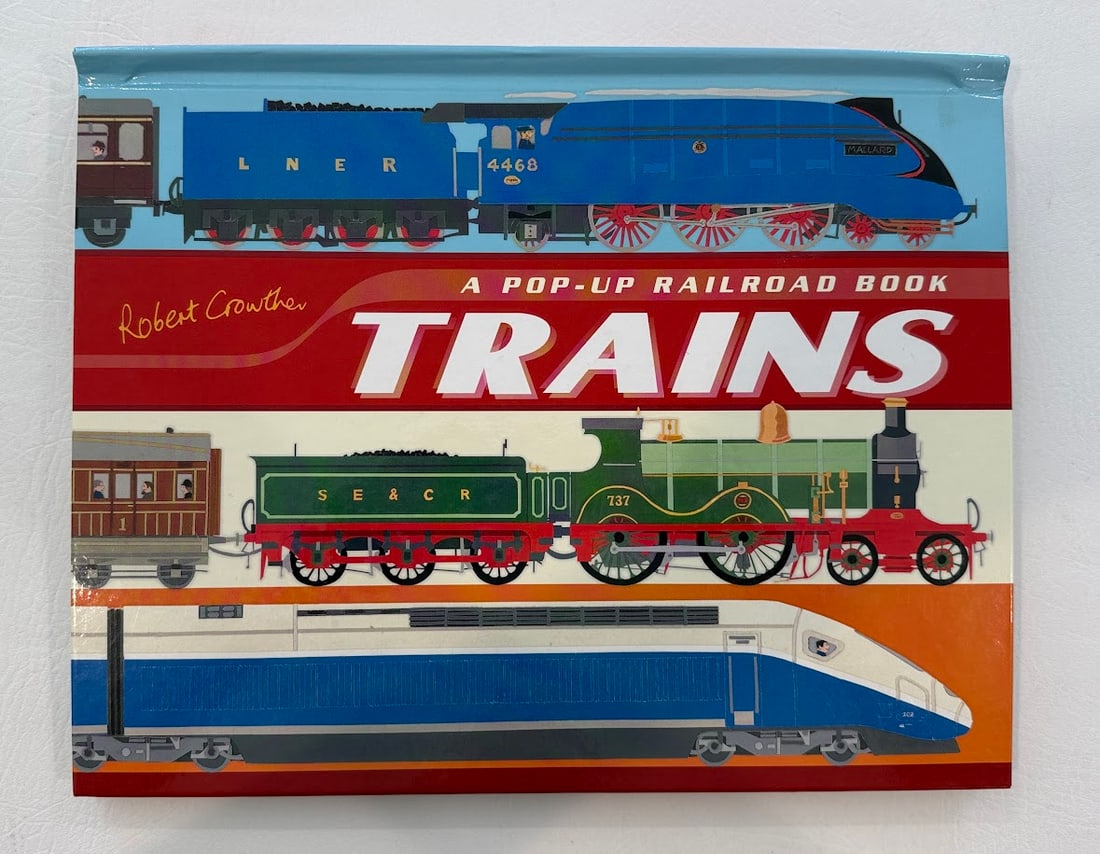 [POP-UP] Robert Crowther. Trains. A Pop-Up Railroad Book.: Cambridge: 2006. Illustrated with color pop-ups, pull-ups, and movables. First printing. SIGNED by Crowther on a special label on the rear cover. Fine copy.