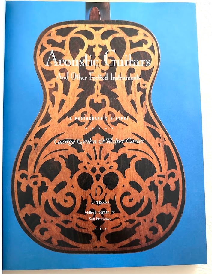 George Gruhn & Walter Carter. Acoustic Guitars and other Fretted Instruments. A Photographic: San Francisco: Miller Freeman, 1993. 4to; boards; color pictorial jacket; illustrated; a few pages with a slight crease at lower right corner, otherwise a near fine copy. First edition. Presentation c