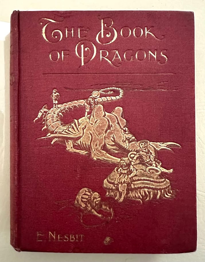E. Nesbit. The Book of Dragons. First edition: London & New York: Harper & Brothers, 1901. 8vo; illustrations by H.R. Millar and decorations by H. Granville Fell; bound in red cloth with gilt lettering and gilt design on the front cover; ink