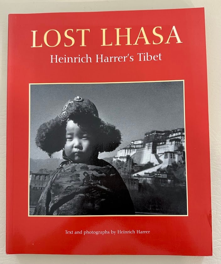 Heinrich Harrer. Lost Lhasa. Heinrich Harrer's Tibet.: New York: Abrams, 1997. Large 4to; 223pp; pictorial card covers; with approximately 200 photographs by Harrer; fine copy. First paper bound edition.