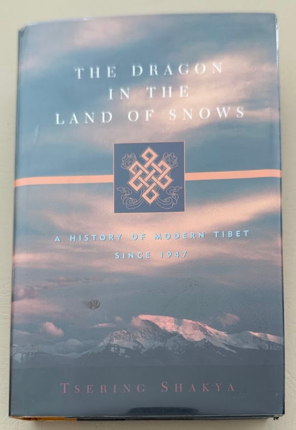 Tsering Shakya. The Dragon in the Land of Snows. A History of Modern Tibet.: New York: 1999. 8vo; 547pp; cloth backed boards; color pictorial jacket; illustrated with photographs and 10 maps; fine copy. First edition.