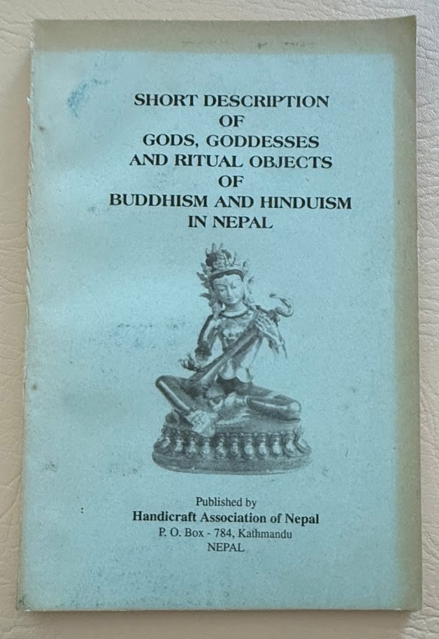 Jnan Bahadur Sakya. Short Description of Gods, Goddesses and Ritual Objects of Buddhism and: Kathmandu: 1998. 8vo; 77pp; pictorial card covers; illustrated; covers lightly browned, otherwise very good. Reprint edition limited to 10,000 copies.