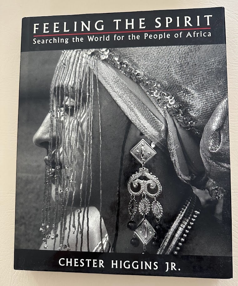 Feeling the Spirit. Searching the World for the People of Africa. Text by Chester Higgins.: New York: 1994. Large 4to; 303pp; cloth; illustrated with numerous b/w images; fine copy. First printing.