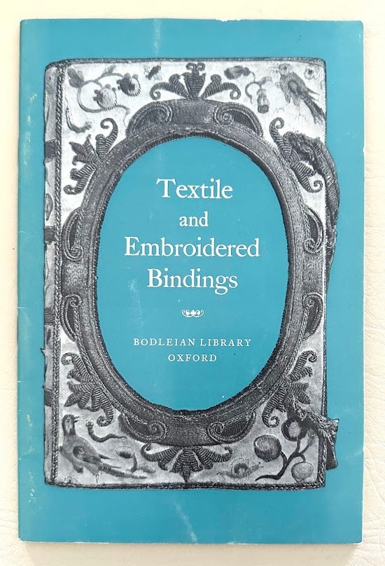 Textile and Embroidered Bindings, by Giles Barber.: Oxford: 1971. 8vo; 11pp + 30 plates; decorative card covers, lightly rubbed, otherwise near fine. First edition.
