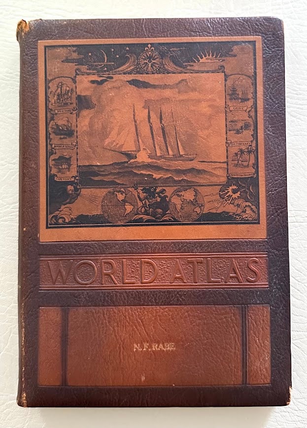 Rand McNally World Atlas. Readers edition.: New York: 1953. 4to; 255pp; plush pictorial stamped leather over boards; with 165 color maps plus others; some wear to covers, otherwise very good. An unusual binding. Apparent 2nd edition.