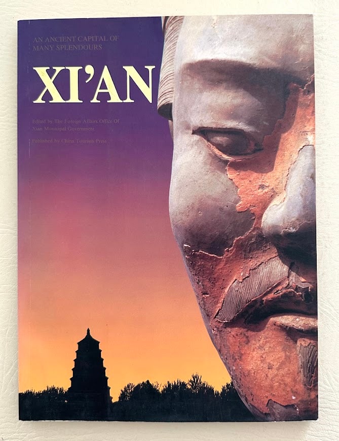 Xi'an. An Ancient Capital of Many Splendours.: Shenzhen: 1996. 4to; 135pp; color pictorial card covers; illustrated throughout; fine copy. First printing.