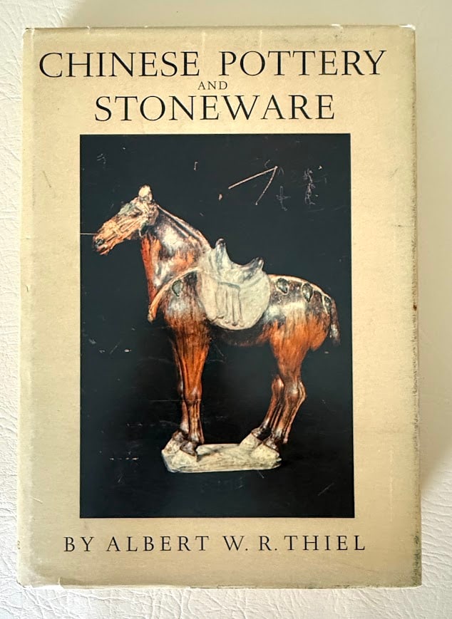 Chinese Pottery and Stoneware, by Albert Thiel.: New York: circa 1953. 8vo; 106pp; gilt lettered cloth; illustrated with 24 color plates and 95 b/w plates; jacket slightly worn, otherwise near fine.