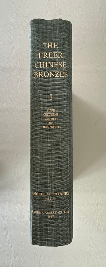 The Freer Chinese Bronzes. Volume 1 Catalogue, by John A. Pope.: Washington 1967. Large heavy 4to; 638pp; decorative cloth; illustrated with 6 color plates plus 110 other illustrations; covers lightly rubbed and faded, otherwise a near fine copy.