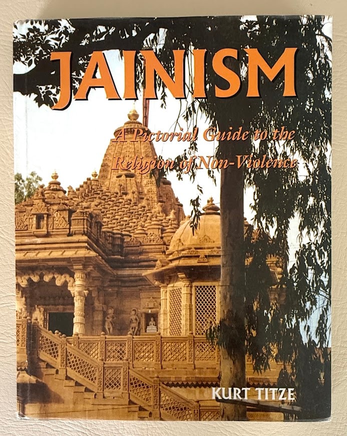 Jainism. A Pictorial guide to the Religion of Non-Violence, by Kurt Titze.: New Delhi: 2001. 4to; 274pp; cloth; color pictorial jacket; illustrated; front cover with a light mark; jacket lightly worn, otherwise very good. Second revised edition.