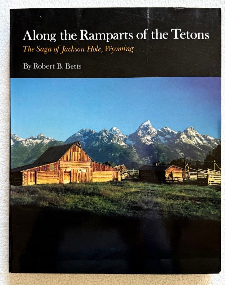 Robert Betts. Along the Ramparts of the Tetons. The Saga of Jackson Hole: Boulder: 1978. 4to; 249pp; color pictorial card covers; illustrated with numerous illustrations. Covers lightly worn, otherwise a near fine copy.