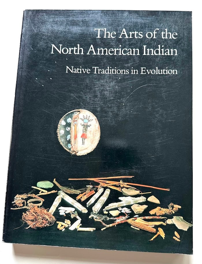 Edwin L. Wade. The Arts of the North American Indian. Native Traditions in Evolution.: New York: Hudson Hills Press, 1986. 4to; 324pp; color pictorial card covers; profusely illustrated throughout with color and b/w photographs. First edition. SIGNED and dated 1987 by Wade. Upper cover 