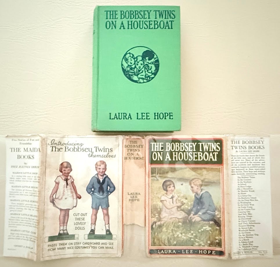 Laura Lee Hope. The Bobbsey Twins on a Houseboat.: New York: Grosset & Dunlap, 1915. 8vo; 244pp; pictorial cloth; color pictorial jacket frontispiece; jacket lacking large piece from lower spine, a few small tears ar edges; former owners signature in 