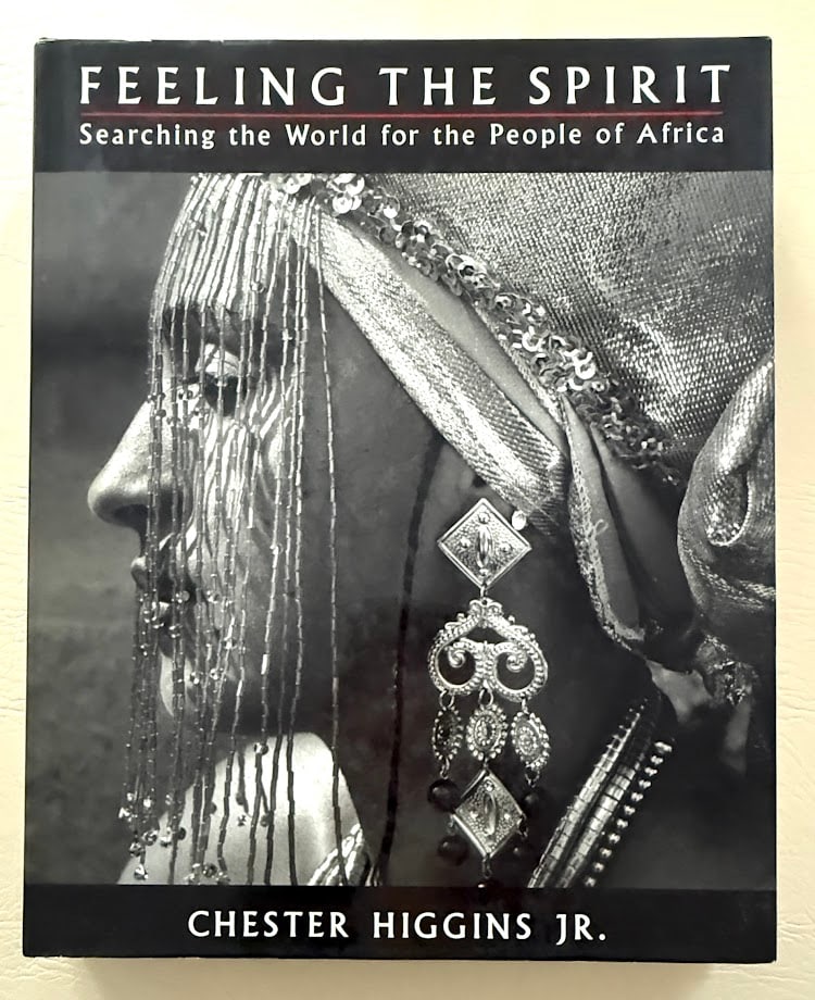 Feeling the Spirit. Searching the World for the People of Africa. Text by Chester Higgins.: New York: 1994. Large 4to; 303pp; cloth; illustrated with numerous b/w images; fine copy. First printing.