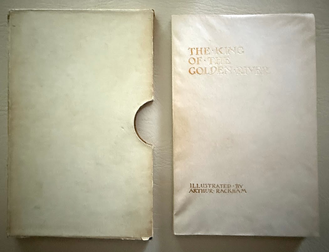 Arthur Rackham. The King of the Golden River, by John Ruskin.: London: 1932. 8vo; 48pp; gilt lettered vellum; illustrated with pictorial end papers and four color plates by Rackham. Front and rear end papers with small, light stains, otherwise fine in the origina