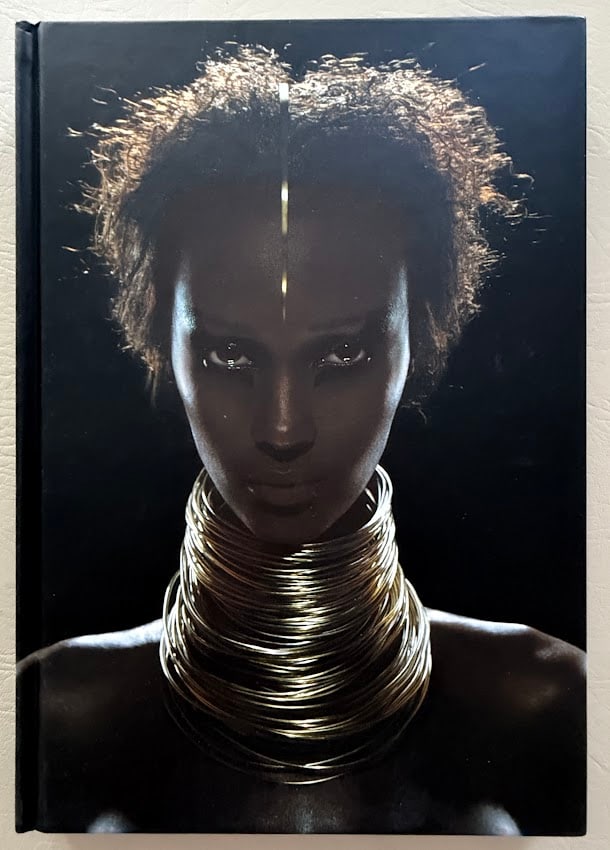 David Bowie. I Am Iman. Signed.: New York: Universe Publishing, 2001. 4to; pictorial boards; illustrated. Fine with original plastic cover. First edition. SIGNED with a dated presentation by Iman.