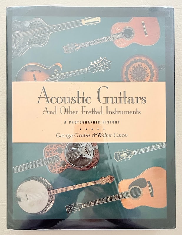 George Gruhn & Walter Carter. Acoustic Guitars and other Fretted Instruments. A Photographic: San Francisco: Miller Freeman, 1993. 4to; 313pp; cloth; color pictorial jacket; illustrated; a few pages with a slight crease at lower right corner, otherwise a near fine copy. First edition. Presenta