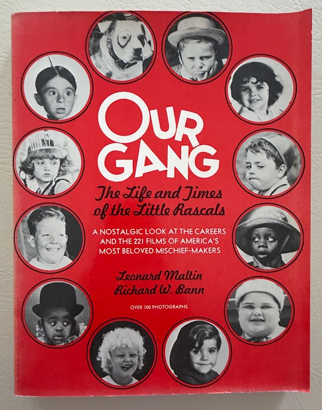 Our Gang. The Life and Times of the Little Rascals, by Leonard Maltin & Richard Bann. Signed.: New York: 1977. 4to; 288pp; illustrated with numerous photographs; color pictorial card covers, lightly worn and rubbed. First edition, later printing. Half title with a warm presentation SIGNED your 