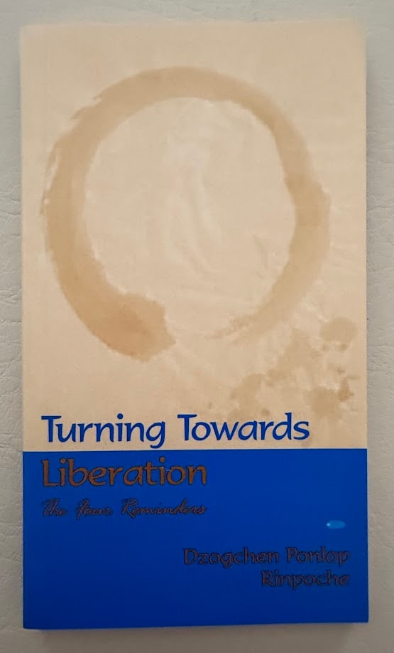 Turning Towards Liberation. The Four Reminders, by Dzogchen Ponlop Rinpoche.: Vancouver: Siddhi Publications, 2000; 12mo; 50pp; color decorative card covers; fine copy.