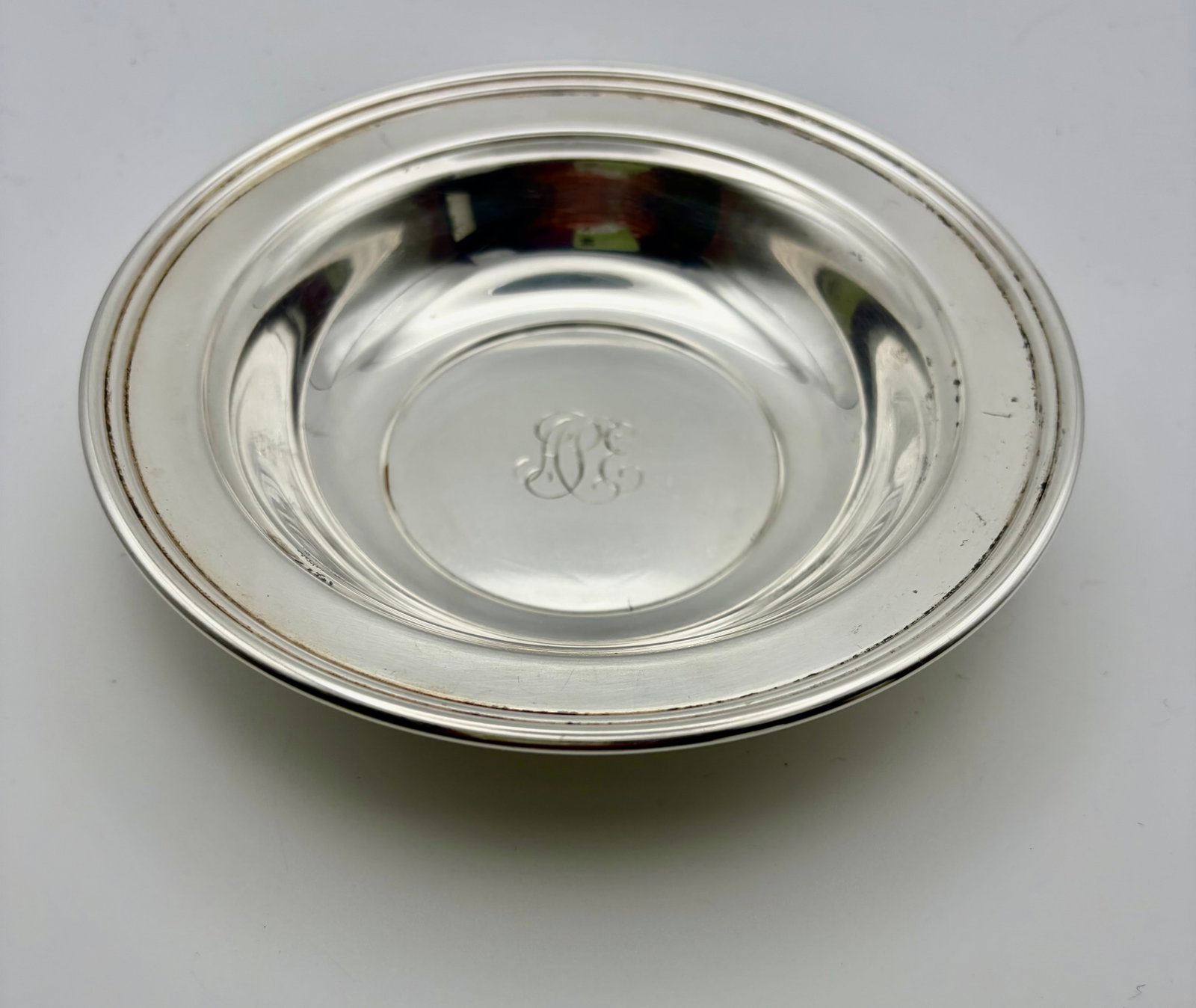 Black Starr & Gorham Sterling Silver Bowl: A vintage 6” round Black Starr & Gorham sterling silver bowl weighing 86.69 grams and featuring an elegant monogram. The bowl is approximately 1’ deep.