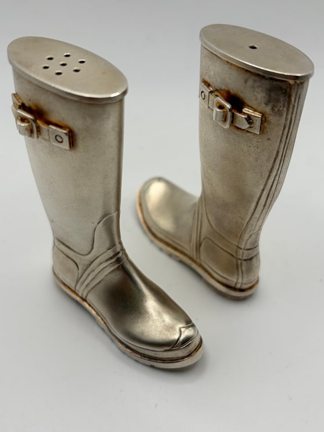 Theo Fennell Sterling Silver Wellington Boot Salt and Pepper Shakers: A pair of Theo Fennell sterling silver salt and pepper shakers crafted into a miniature Wellington boots with realistic detailing. Each boot stands 3.25” tall and together weigh 304.89 grams. Th