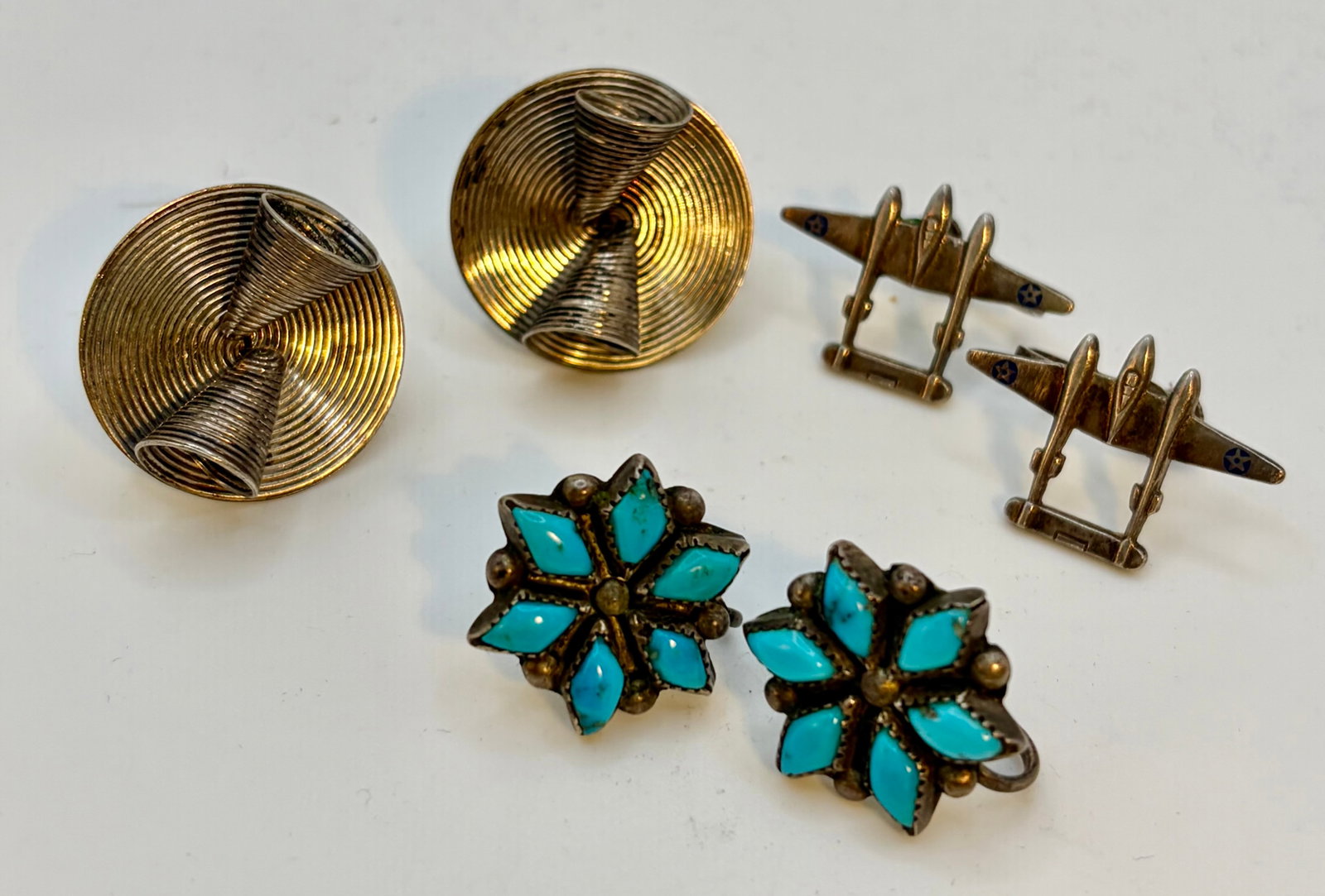 Three Pairs of Vintage Sterling Silver Earrings: Three unique pairs of vintage sterling silver screw-back earrings. A Modernist pair of sterling silver earrings by Beau, a pair of turquoise and sterling silver earrings in a flower shape, and a pair 
