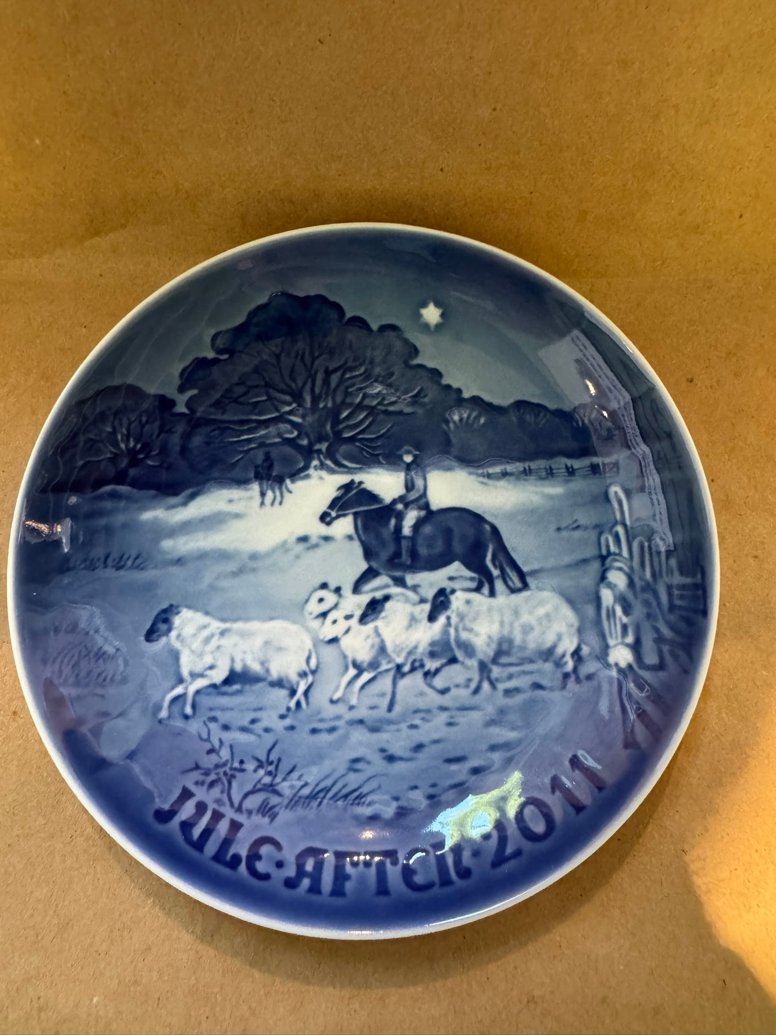 2011 - Home for Christmas: COA -Up for auction is a pristine Bing & Grondahl Christmas Plate titled '2011 - Home for Christmas'. This exquisite collector's item was originally issued in the year 2011. Featuring the
