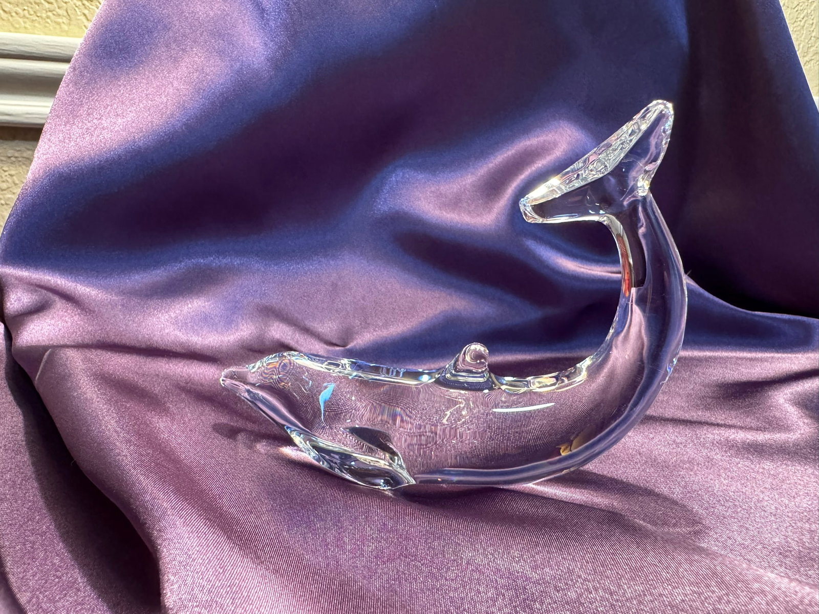 Baccarat Clear Crystal Dolphin Figurine: Fluid and dynamic clear crystal dolphin figurine by Baccarat, France. Heavy, high-quality crystal showcasing beautiful light refraction.
