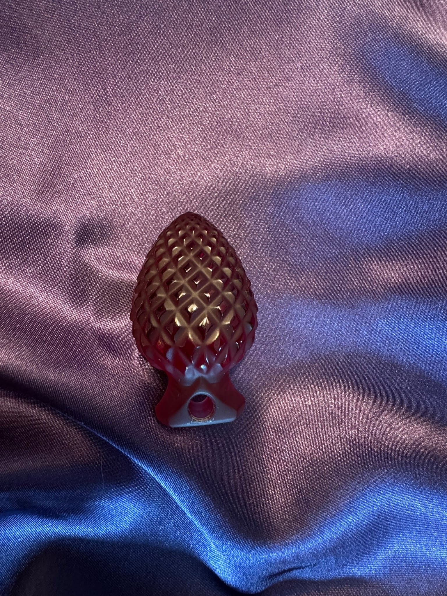 Lalique Ruby Red Crystal Pinecone Ornament: A gorgeous Lalique France deep ruby red crystal pinecone holiday ornament. The rich color and textured diamond pattern catch holiday lights beautifully.
