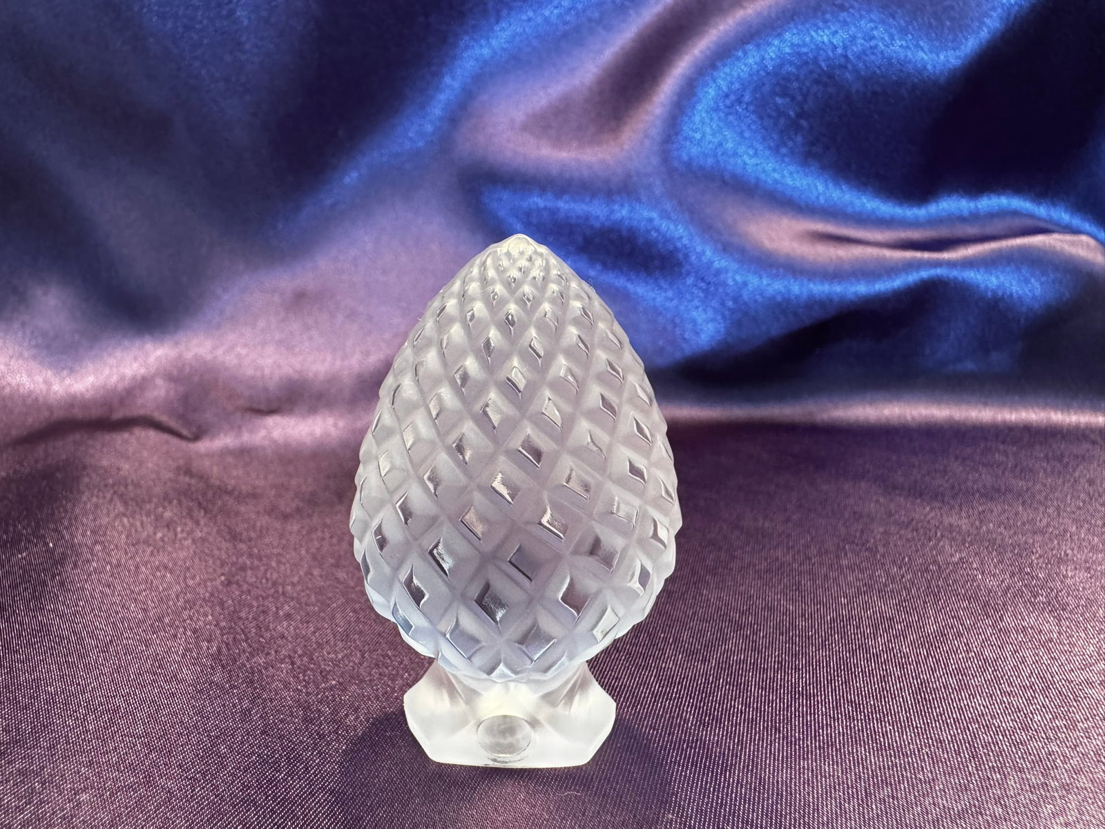 Lalique Frosted Crystal Pinecone Ornament: A charming Lalique France frosted crystal pinecone ornament. The deeply faceted diamond-cut texture beautifully diffuses the light.