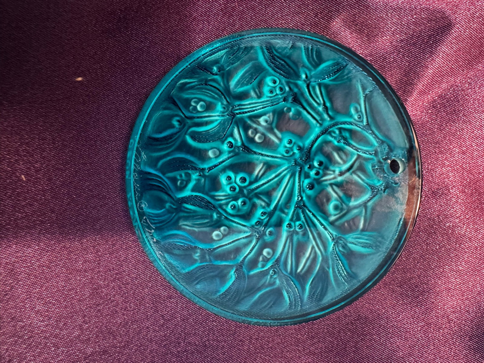 Lalique Teal Crystal Mistletoe Holiday Ornament 1989: A stunning Lalique France teal/turquoise colored crystal annual Christmas ornament featuring an intricate mistletoe and leaf motif in high relief.