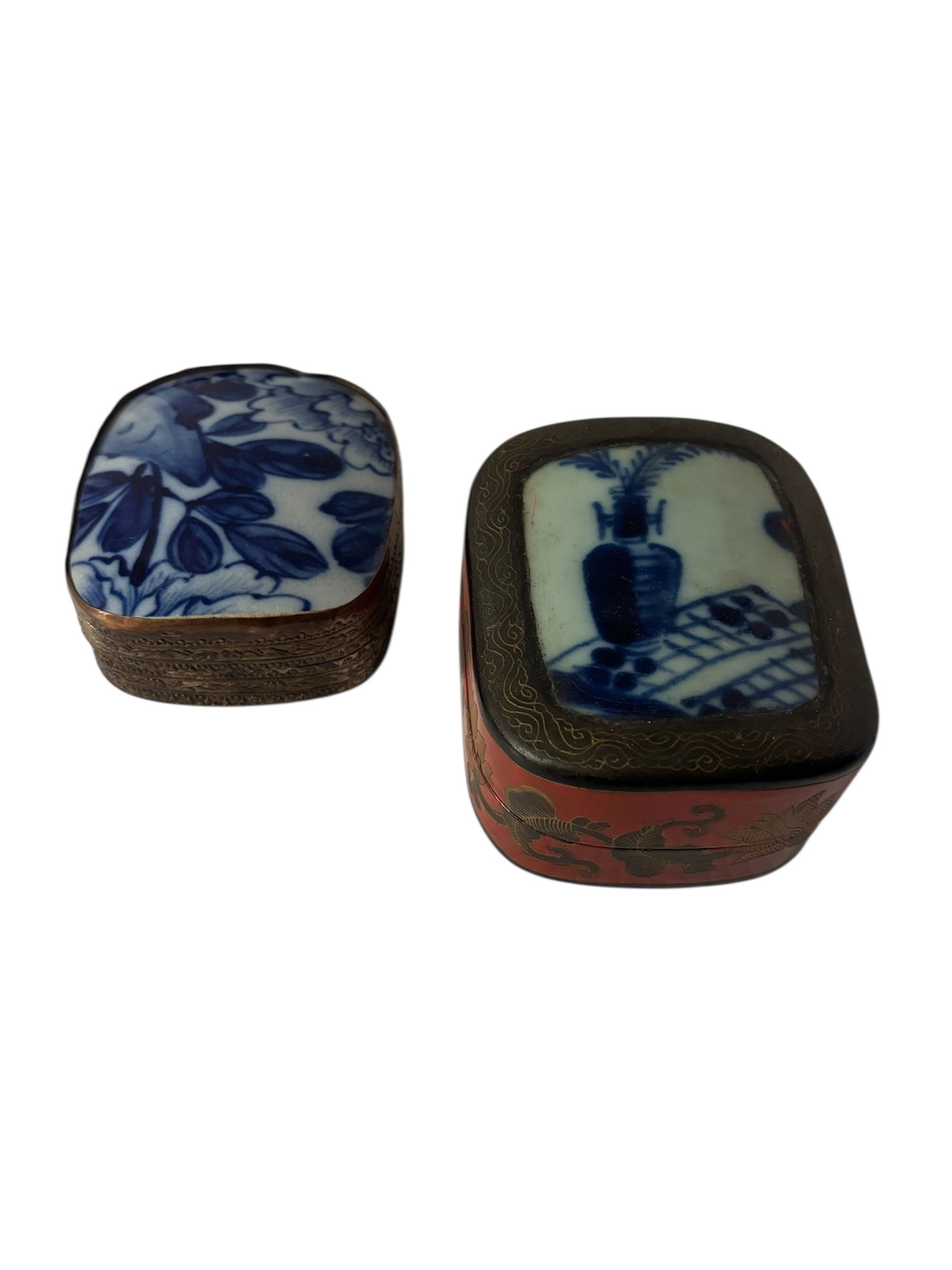 Vintage Porcelain Shard Boxes: Featuring Chinese red lacquered box with porcelain shard lid insert muted gold painted motif on rim and still life scene on lid with hand painted blackened gold traditional lotus blossom motif. Also i