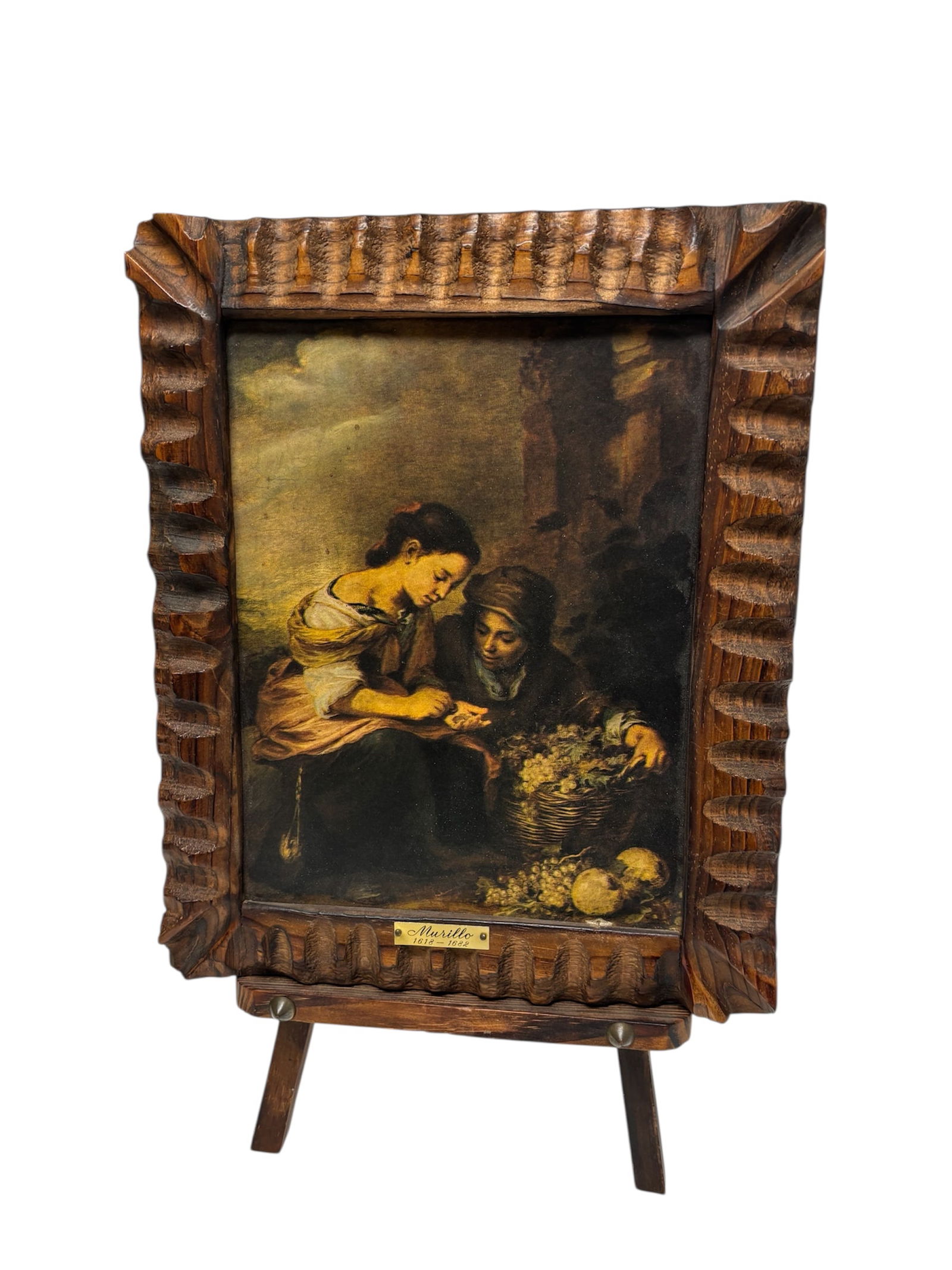 "The Little Fruit Seller" by Murillo Print on Board & Easel: Well known Baroque scene by Bartolome Esteban Murillo presented in an ornate carved wooden frame on an attached easel. Plaque on frame reads "Murillo 1618-1682" 7" easel span, 16.5" tall