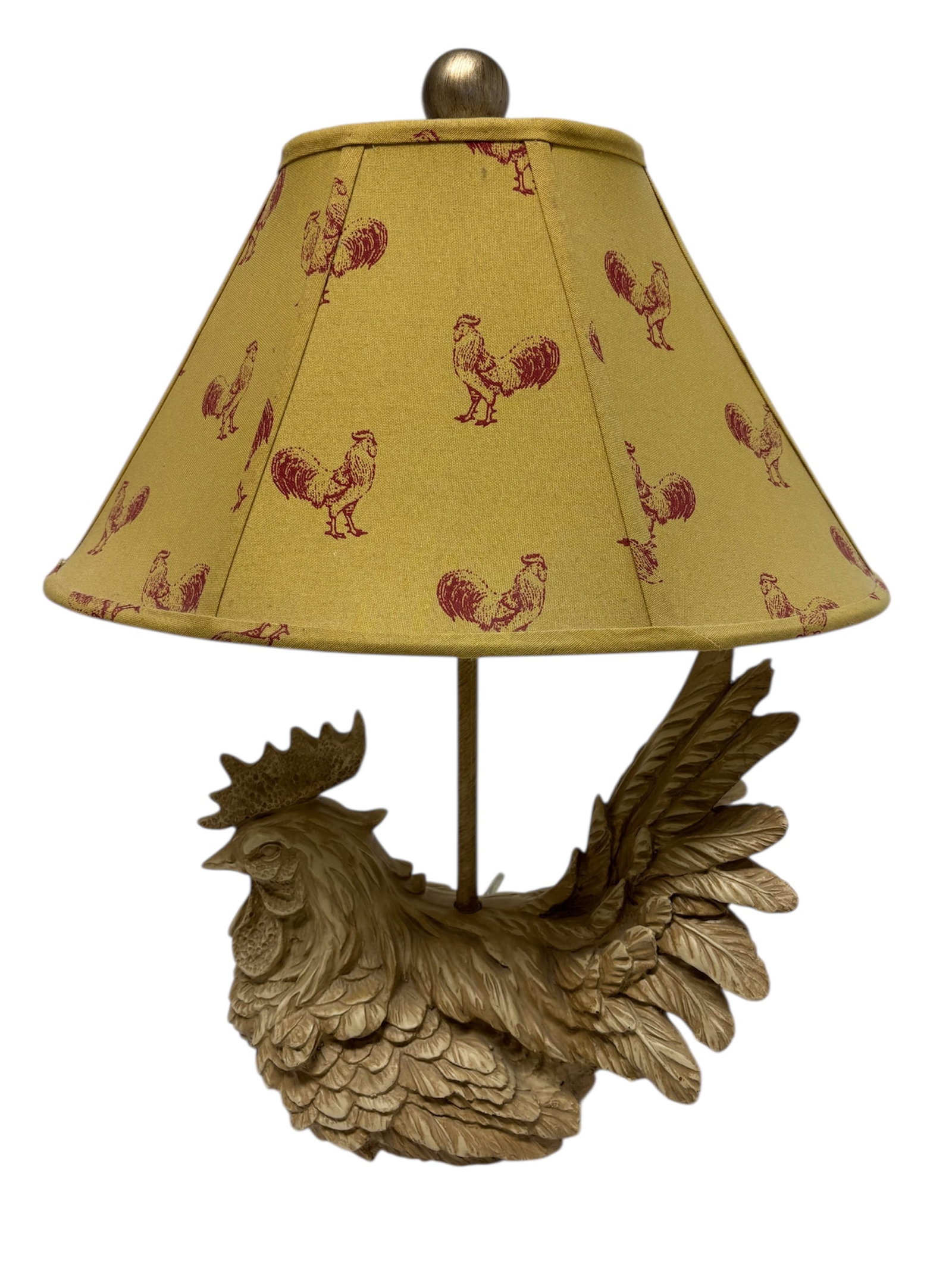 Nesting Rooster Lamp With Rooster Toile Shade: Rooster shaped farmhouse style table lamp with carved design of composite material in light beige depicting a rooster nesting. Including French toile style shade and finial.