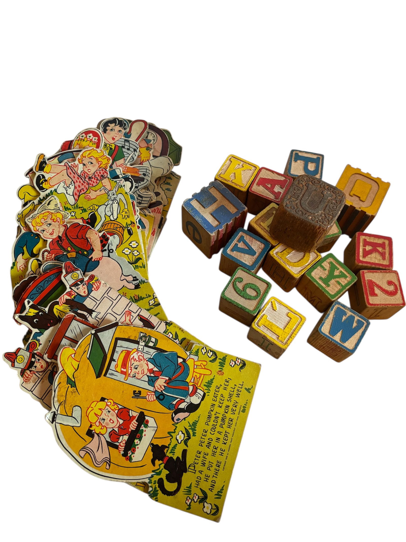c. 1940 Nursery Rhyme Cardboard Cutouts & Wood Blocks: Assorted cardboard cutouts 4.5x6" of old nursery rhymes like Wee Willie Winkie, Peter Peter Pumpkin Eater, and more! Also included in lot assorted wooden alphabet blocks embossed lettering, collectibl