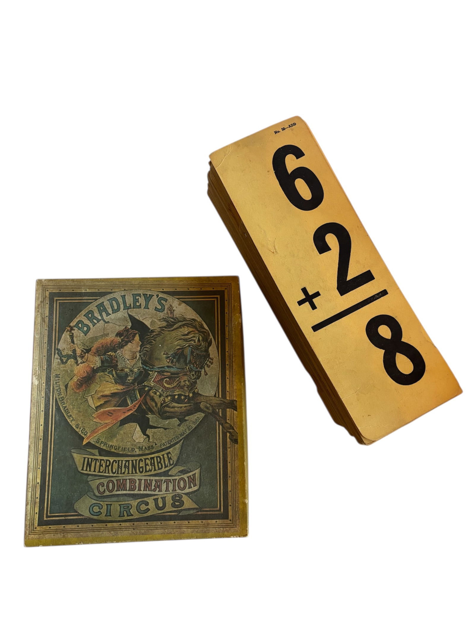 Mid Century Educational Flash Cards & Vintage Circus Game: Mid Century set of math flashcards 9x3 with large numerals in black on long paper cards. Also included Bradleys' interchangeable combination circus picture toy c. 1970 3x6 pieces arrange in numerous w
