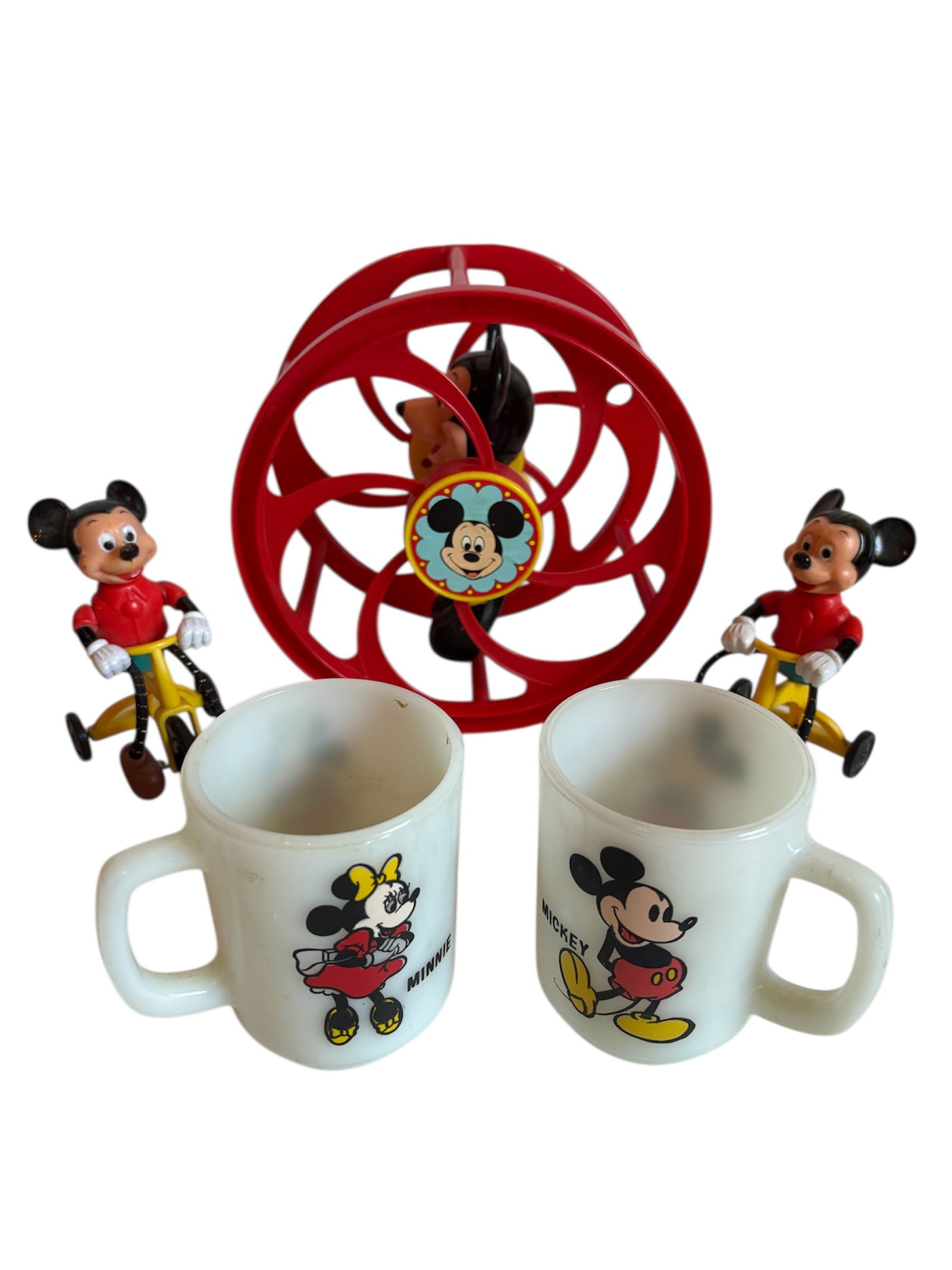 Vintage Walt Disney Mickey Mouse Toys & More: 1970s Mickey Mouse rolling wheel toy with red plastic and Mickey figure in center, decals on sides, 1977 W.D. Mickey Mouse on tricycle (2) action toys featuring yellow, red and blue colors with riding