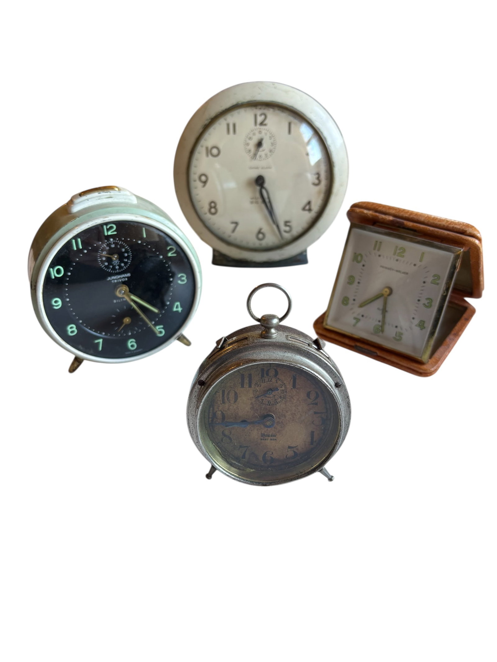Collection of Antique & Mid Century Alarm Clocks: Including Westclox Big Ben in ivory metal 6", silver finish Westclox Baby Ben, Junghans Trivox alarm clock in sage green and a Phinney-Walker travel alarm clock with leather case.