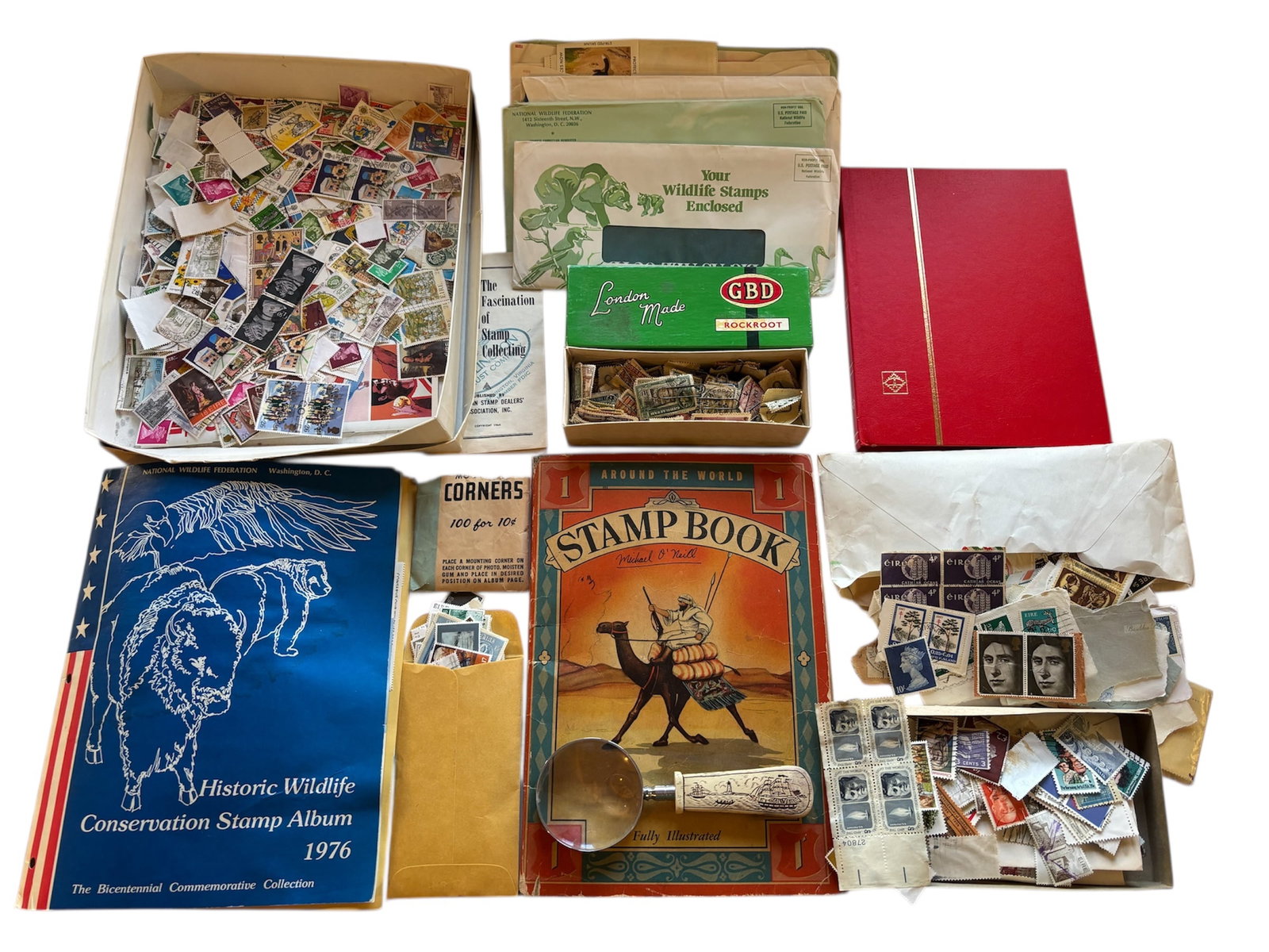 Around the World Stamp Book & Large Lot of Vintage Stamps: Stamp album with some stamps, a large collection of assorted postage stamps European and American, some not used, mostly used, stamp collecting guides/books. Stamp books are not complete approximately