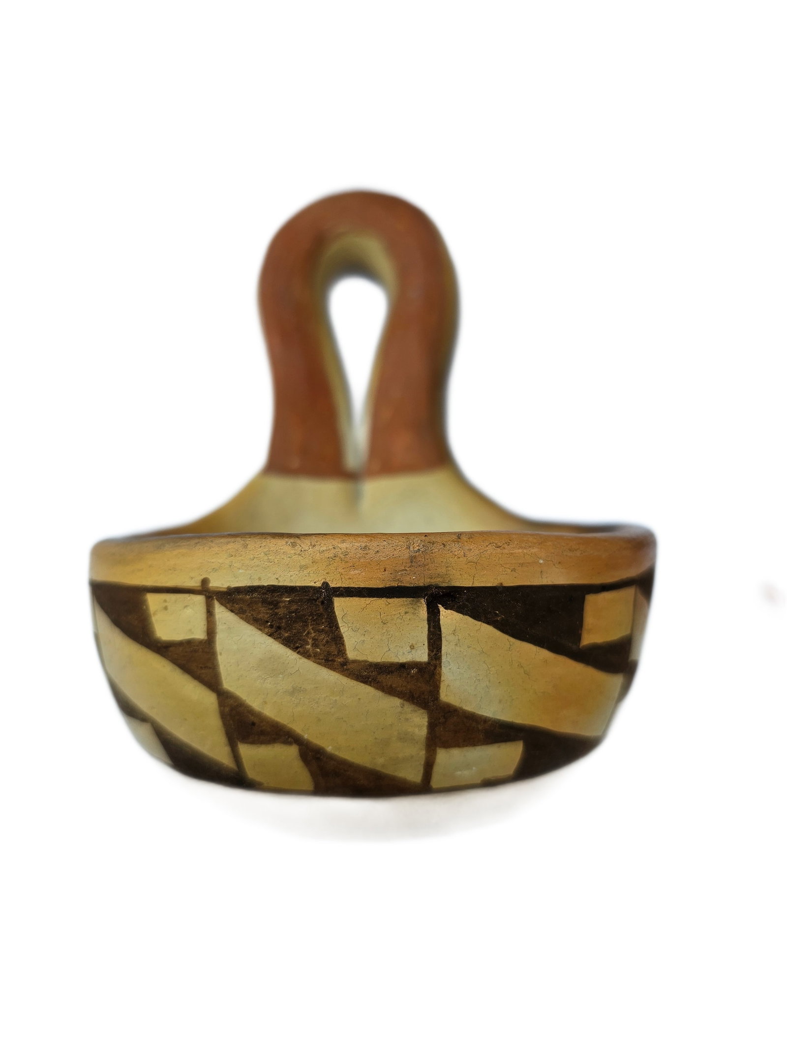 HOPI POTTERY LADLE SIGNED AND DATED 1968: Distinctive vintage handcrafted pottery ladle executed in a traditional Southwest Native-inspired form, signed and dated 1968. The sculptural piece features a gracefully looped handle with a warm hand