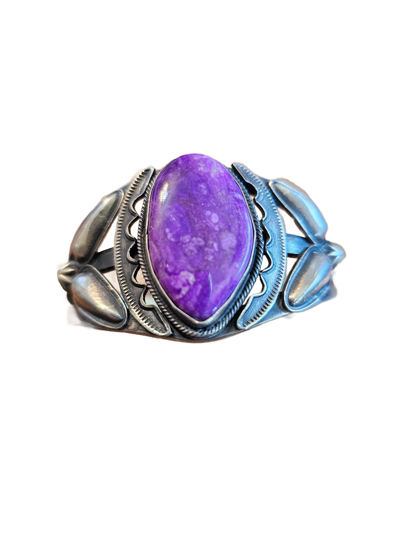 Vintage Navajo Sugilite Sterling Silver Cuff Bracelet – Signed Herbert Ration: Exceptional vintage Navajo cuff bracelet handcrafted in sterling silver and set with a striking natural sugilite cabochon. The stone exhibits a rich, saturated purple coloration with soft natural matr
