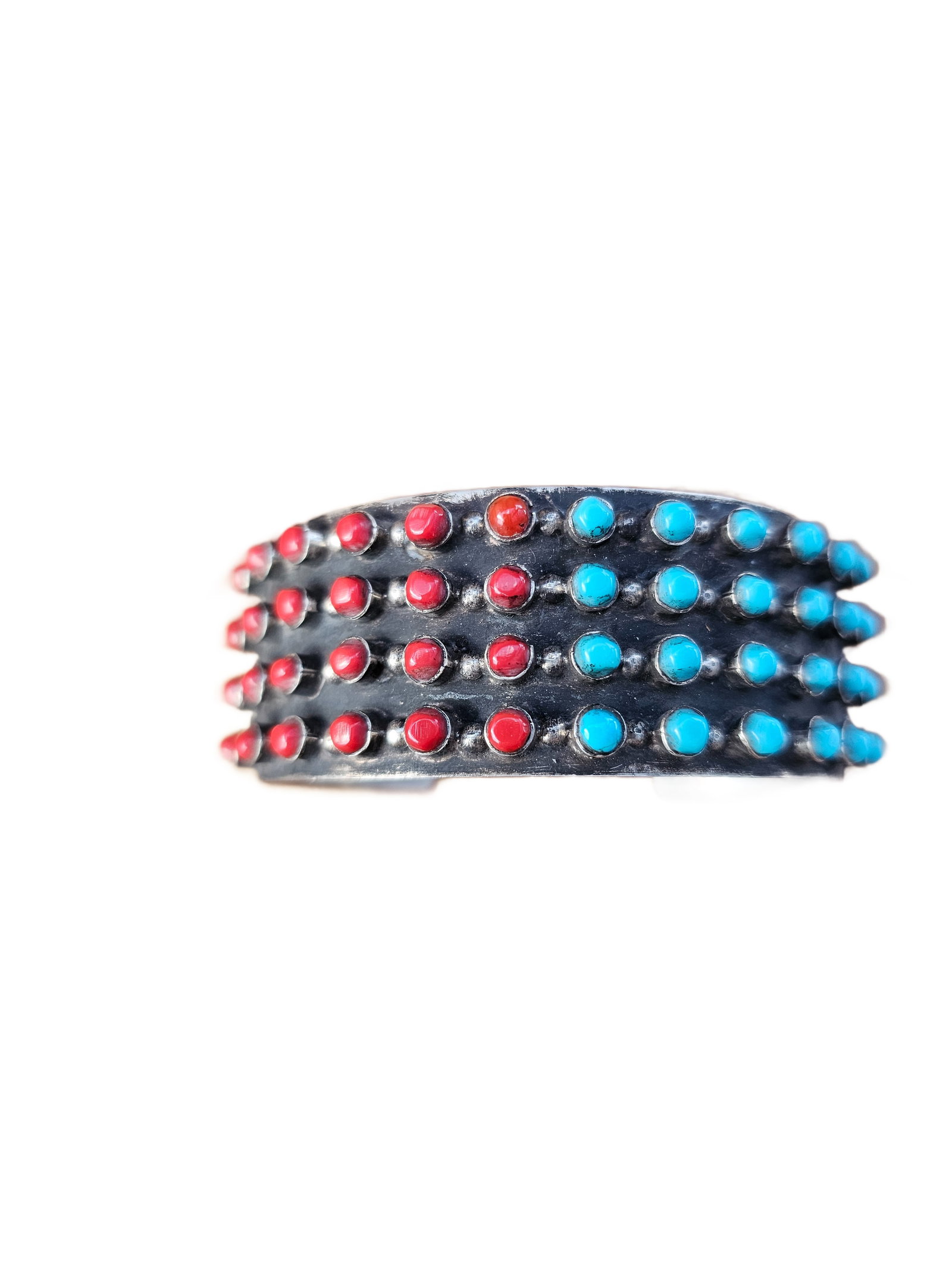 Vintage Sterling Silver “Snake Eyes” Cuff Bracelet – Turquoise & Coral Style – Signed: Offered here is a bold and highly collectible “Snake Eyes” style sterling silver cuff bracelet, featuring multiple rows of vivid red and turquoise-colored stones set across a wide, oxidized si