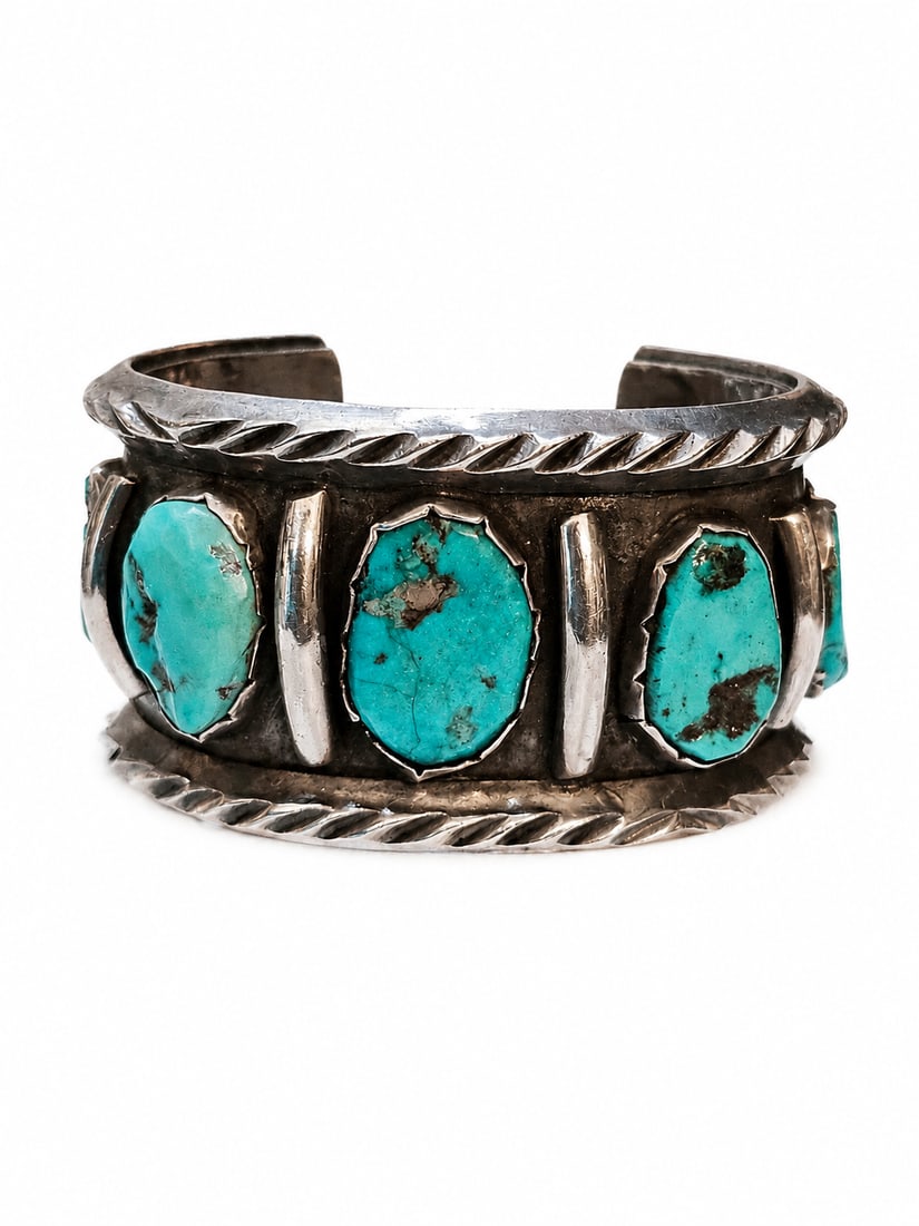 Zuni Signed “W” Sterling Silver Turquoise Row Cuff Bracelet – Heavy 118g: Substantial Zuni sterling silver cuff bracelet featuring a bold row of natural turquoise cabochons set in a wide, hand-fabricated band. The bracelet displays five oval turquoise stones with attractive