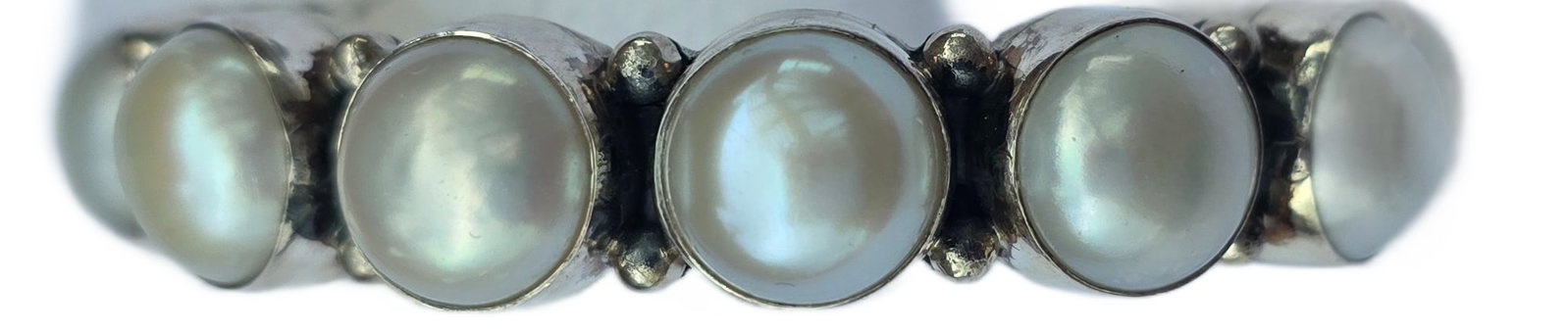 Exceptional Navajo Sterling Silver & Pearl Cuff Bracelet by Ryan Sanchez: A powerful and highly collectible contemporary Navajo cuff by noted silversmith Ryan Sanchez, whose work is increasingly sought after for its clean, modern interpretation of traditional forms.This sub