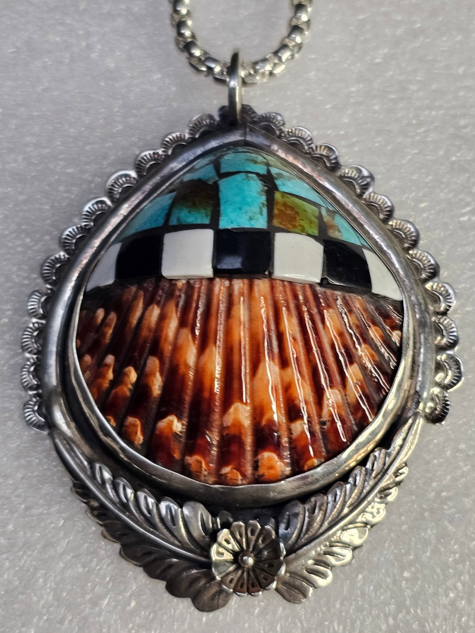 Contemporary Santo Domingo / Kewa Pueblo Sterling Silver, Spiny Oyster Shell & Multi-Stone Inlay Pen: Large and exceptionally crafted contemporary Santo Domingo (Kewa Pueblo) sterling silver pendant featuring dimensional carved spiny oyster shell combined with intricate geometric mosaic inlay work. Th