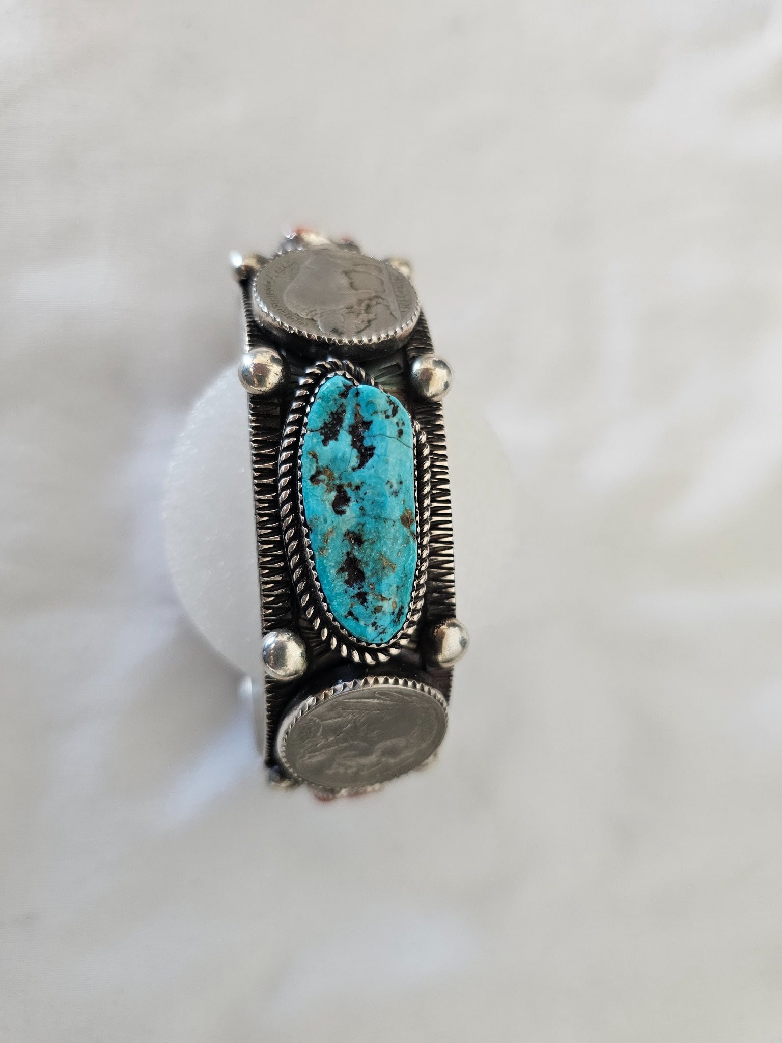 Ben Yellowhorse Turquoise Coral Coin Sterling Cuff 102.27g: Substantial sterling silver cuff by Ben Yellowhorse combining turquoise and coral with bold Southwest silverwork and coin-form detail. The bracelet has a strong one-inch-wide profile and a substantial